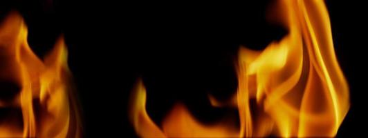 fondo de fuego. llama ardiente abstracta y fondo negro. foto