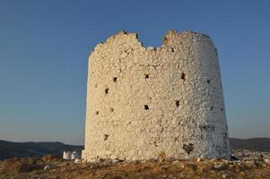 Bodrum windmill for the extraction of olives architecture in Turkey photo