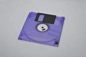 Retro media discs and floppy disks on a white background photo