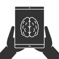 Hands holding tablet computer glyph icon. Artificial intelligence. Silhouette symbol. Tablet computer with brain. Negative space. Vector isolated illustration