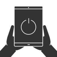 Hands holding tablet computer glyph icon. Device turning off. Silhouette symbol. Tablet pc with power button. Negative space. Vector isolated illustration