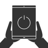 Hands holding tablet computer glyph icon. Device turning off. Silhouette symbol. Tablet pc with power button. Negative space. Vector isolated illustration