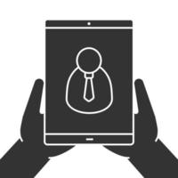Hands holding tablet computer glyph icon. Silhouette symbol. Tablet computer with businessman. Negative space. Vector isolated illustration