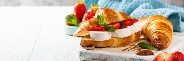 Sandwich croissant with goat cheese photo