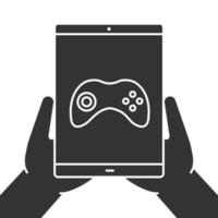 manos sosteniendo el icono de glifo de tableta. símbolo de silueta. tableta con gamepad. espacio negativo. vector ilustración aislada