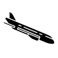 Plane flying down glyph icon vector