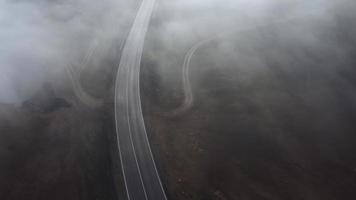 Cars on the foggy mountain highway video