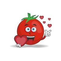 Tomato mascot character holding a love icon. vector illustration