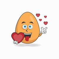 Egg mascot character holding a love icon. vector illustration