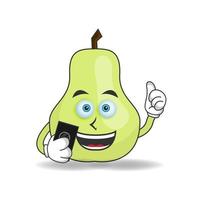 Guava mascot character holding a cellphone. vector illustration