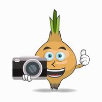 Onion mascot character holding camera. vector illustration