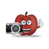 Apple mascot character holding camera. vector illustration