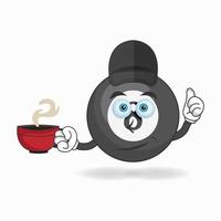 Billiard ball mascot character holding a hot cup of coffee. vector illustration