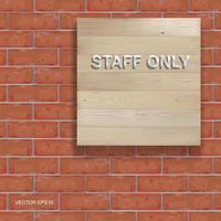 Staff only - text on background of wood board texture and red brick wall pattern. Vector. vector