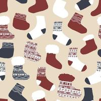 Winter hand drawn socks, knitted warm clothes seamless pattern for Christmas time. Vector illustration in beige, white, blue, red colors