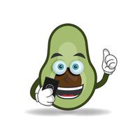 Avocado mascot character holding a cellphone. vector illustration