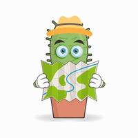 el personaje de la mascota del cactus sostiene un mapa. ilustración vectorial vector