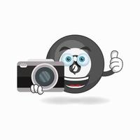 Billiard ball mascot character holding camera. vector illustration