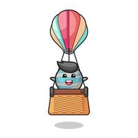 planet mascot riding a hot air balloon vector