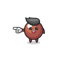 chocolate ball cartoon with pointing left gesture vector