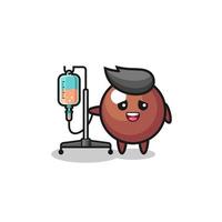 cute chocolate ball character standing with infusion pole vector