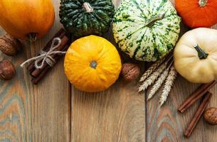 Pumpkins on a wooden table photo