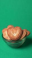 Delicious homemade heart shaped cookie on a color background. Top View. Place for text. photo