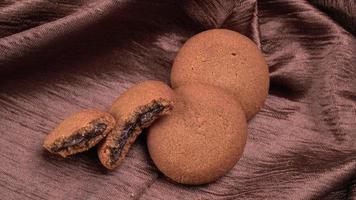 Stack tasty and Chocolate cookies on a beautiful background. photo