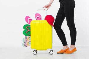girl with suitcase isolated on white background .Summer holidays. summer flip flops or slippers. Travel valise or bag. Mock up. Copy space. Template. Blank. photo