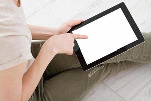 Girl sitting with tablet in hands.Top view.Mock up.Copy space.Template.Blank. photo