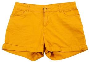 Vista superior de pantalones cortos de color naranja en aislamiento simulacro de primer plano foto