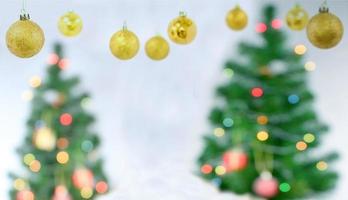 Christmas ball hanging on Christmas tree with bokeh photo