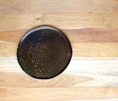 Empty plate on wooden table photo