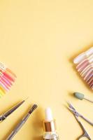 Flat lay manicure tools on a colored background with copy space photo