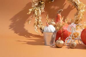 Autumn still life of pumpkins, dried flowers and decorative elements photo