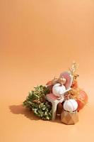 Autumn still life of pumpkins, dried flowers with a candle with copy space photo