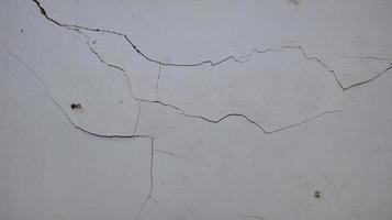 Cement wall collapse. Cracked concrete old wall. dangerous, damaged building structure.