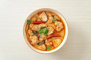 spicy boiled pork soup with mushroom - Tom Yum photo