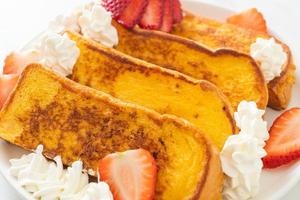 french toast with fresh strawberry and whipping cream photo