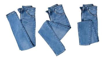 Denim set isolated, folded blue jeans pants collage over white photo