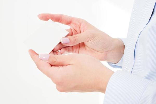 Female Hand Holding Id Card
