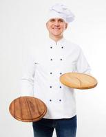 smiling chef holding empty pizza boards isolated on white background photo