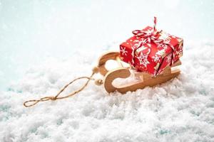 Christmas toys sled with gift box photo