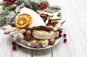 Christmas stollen on wooden background photo