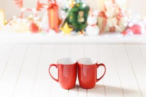 Couple red mugs on Christmas photo