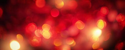 Defocus light red glitter. Abstract background red with black with shine. photo