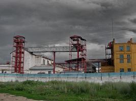 Depressive territory of abandoned industrial area, old warehouses photo