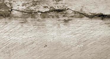 Textura de cemento agrietado gris para el fondo. arañazos en la pared foto