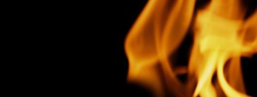 Fire background. Abstract burning flame and black background. photo