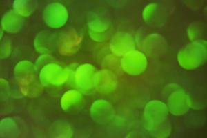 Round shape defocus lights are green. Material for the designer. Blurred bokeh. photo